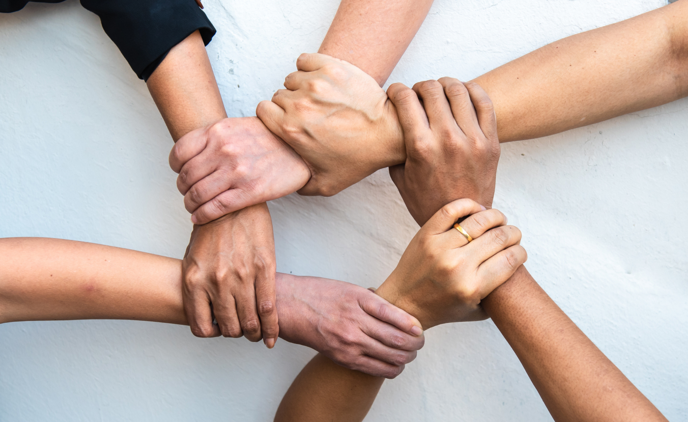 Volunteers holding hands